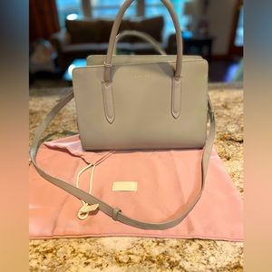 Radley of London leather bag color is sea foam green. Structured w/many pockets.